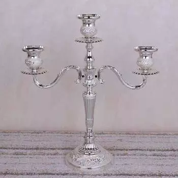 Подсвечник тройной серебряный