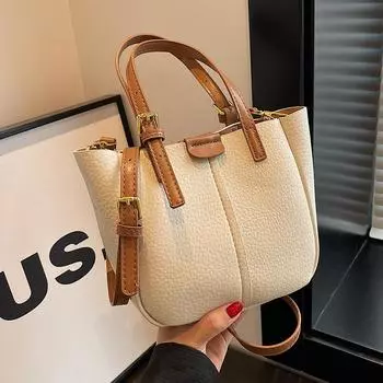 Популярная в этом году маленькая женская сумка, новинка 2023 года, летняя универсальная сумка через плечо, текстурированная взрывная корейская ручная сумка-ведро розовый