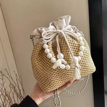 Популярная в этом году женская сумка из бисера. Новинка 2024 года, летняя повседневная тканая сумка из травы с дизайнерским шнурком. Сумка-ведро.