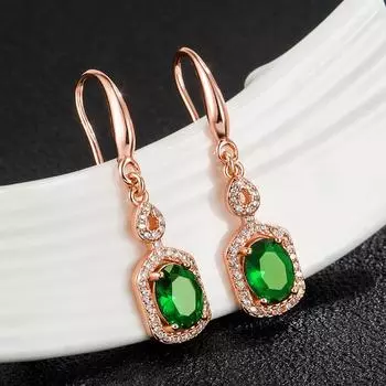 Популярные европейские и американские серьги с красными изумрудами