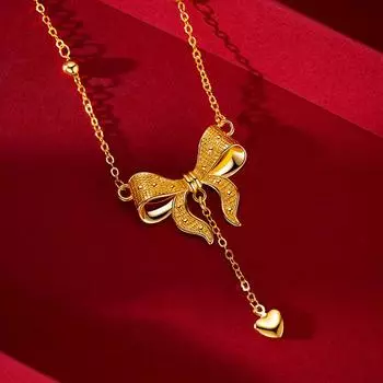 Позолоченное женское колье с бантом Love на ключице золотой