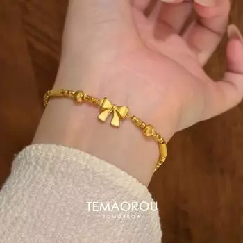 Принцесса в бегах ~ Аллювиальное золото Невыцветающие банты Золотой браслет для женщин Милый Легкая роскошь Меньшинство Причудливые украшения для рук Bows Sand Gold Bracelet Single