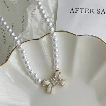 Ретро элегантное белое искусственное жемчужное ожерелье-бантик модная ключичная цепочка с жемчужным бантом подвески нишевое передовое колье-чокер ювелирные изделия one size