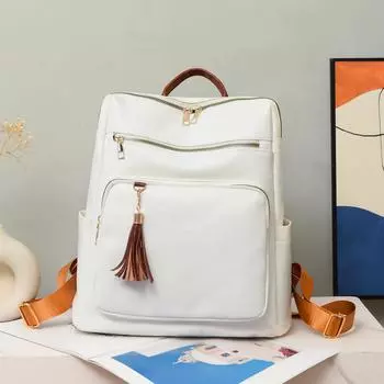 Рюкзак из мягкой кожи. Женский рюкзак с кисточками. Рюкзак большой емкости с несколькими отделениями. коричневый