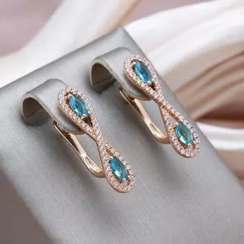 Серьги Kinel с симметричным розовым золотом и синим цирконом розового золота