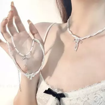 Серебряное ожерелье с подвеской в виде банта из жемчуга — элегантный двухслойный дизайн N0789