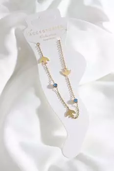 Серебряный браслет с детализацией «сглаз» и стальной фигуркой птицы