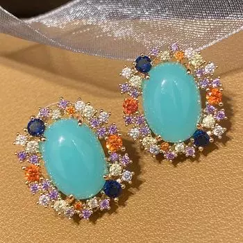 Шикарные серьги-гвоздики CMM золотого цвета с многоцветным цирконием и большими размерами светло-синий