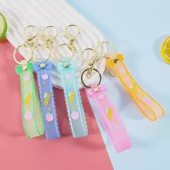 Силиконовый брелок-бантик с блестками и кожаным ремешком - подарочный аксессуар в мультяшном стиле