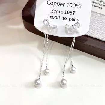 Silver Bow Tassel Earrings - Chic and Elegant Design