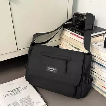 Simple and versatile messenger bag female large-capacity student class bag tooling tide casual mailman bag male