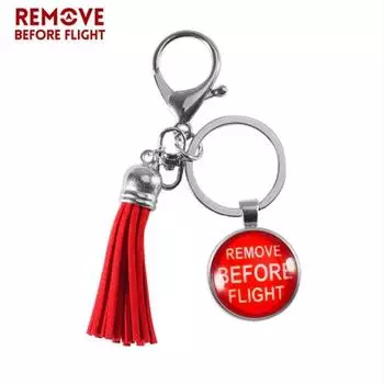 Снимите перед полетом красную подвеску-шар с кисточками, брелки, подвеску-сумку красный
