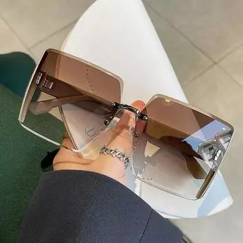 Солнцезащитные очки без оправы в стиле ретро с овальной металлической оправой и модными цветовыми тонами One Size коричневый