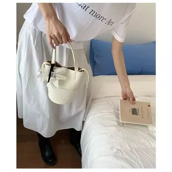 South korea Fresh Niche Design Bucket Bag Women High Sense Fashion Work Commuter Hand Bag Shoulder Small Bag White belt pendant