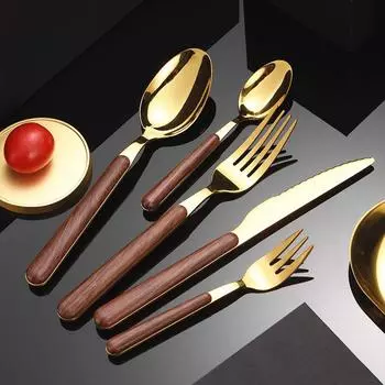 Столовая посуда из нержавеющей стали с имитацией деревянной ручки. Столовые приборы для дома. Столовая посуда. Нож. Вилка. Ложка. Чайная ложка. Кухонная утварь.