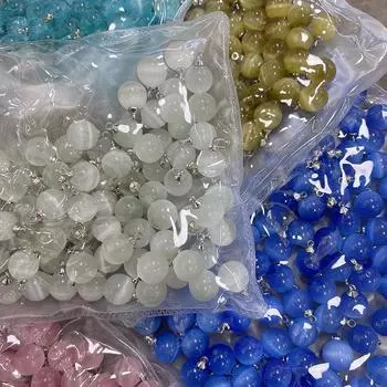 Свитер-кардиган с перламутровыми пуговицами и серебристым низом