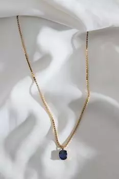Темно-синее большое колье золотого цвета с одним камнем