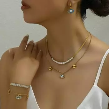 Three-layer niche long necklace set, turquoise blue eye pendant, earrings inlaid with zircon bracelet.