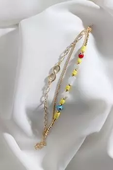 Трехкомпонентный браслет желтого цвета Fimo с бусинами золотого цвета и устройством бесконечности