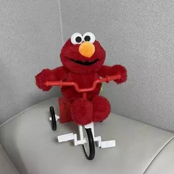Улица Сезам Кукла Элмо на велосипеде