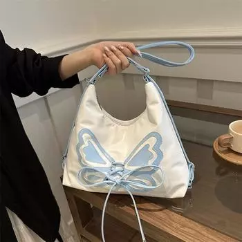 В этом году особой популярностью пользуется нишевый серебристый рюкзак-бабочка для женщин 2024 года, новый многофункциональный рюкзак-мессенджер на одно плечо в стиле Spice Girl. чёрный