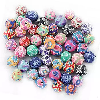 В упаковке 50 круглых прокладок из полимерной глины с цветочным рисунком для изготовления ювелирных изделий диаметром 10 мм.