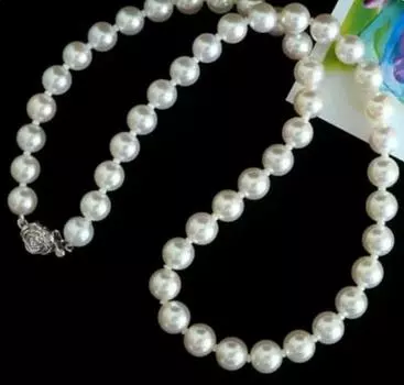 Великолепное ожерелье из круглого белого пресноводного жемчуга диаметром 9-10 мм и диаметром 20 дюймов.