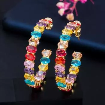 Великолепные серьги-кольца WWJ овальной огранки с радужным цирконием золотого цвета разноцветный