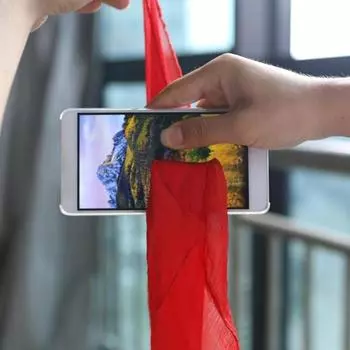 Волшебные трюки Динамо-шарф через телефон Крупный план Маги Забавный шелк через телефон Трюк Игрушки