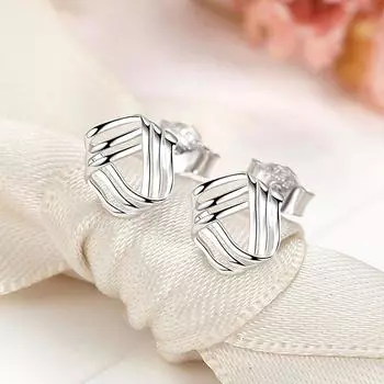 Вращающиеся треугольные серьги-гвоздики женские креативные полые трехлинейные переплетенные украшения для ушей