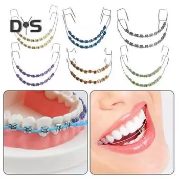 Временное украшение зубов металлической проволокой Брекеты Ортодонтические лигатуры Ортодонты объясняют Реквизиты для практики студентов-стоматологов фиолетовый