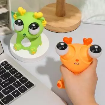 Выскакивающий глаз дракона сжимает игрушку для снятия стресса и беспокойства сидящий мультяшный дракон щипок синий
