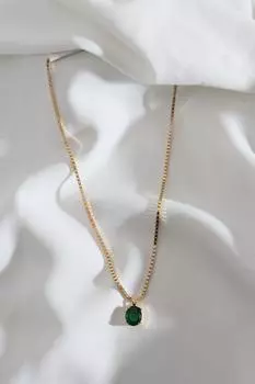 Зеленое ожерелье золотого цвета с большим одним камнем
