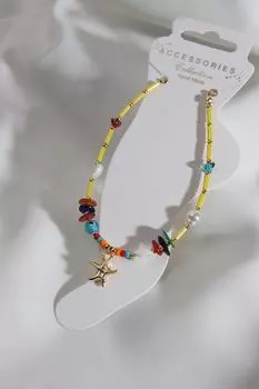 Желтый браслет из бисера золотого цвета с морской звездой