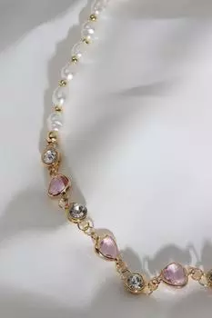 Жемчужное ожерелье с розовым треугольным камнем