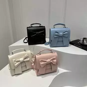Женская мода однотонный маленький рюкзак элегантный бант декор искусственная кожа ручная сумка-ведро на плечо для путешествий на открытом воздухе 20x9x20.5cm розовый