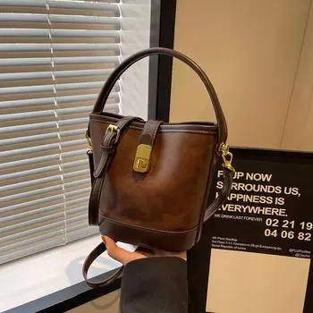 Женская сумка 2024 года, новая сумка-мессенджер, осенне-зимняя сумка-ведро, ретро-дизайн, иностранное чувство, женская сумка через плечо 20*10*18 коричневый