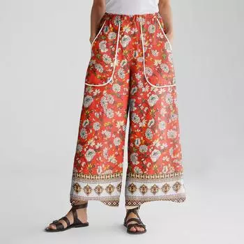 Женские брюки широкие от бедра с эластичным поясом, с принтом, с большими карманами, с отделкой пэчворк по краю, свободные M шафрановый