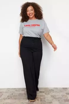 Женские стильные трикотажные брюки больших размеров в рубчик черного цвета