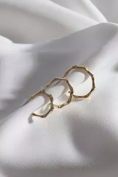 Женский комплект из трех серег-кольц золотого цвета