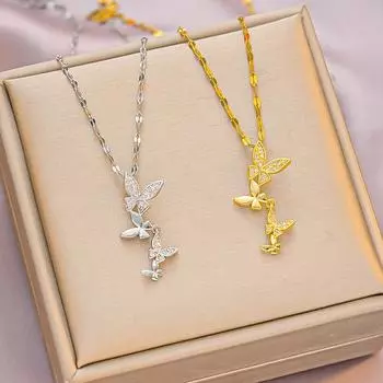 Женское колье с кисточками-бабочками и бриллиантами