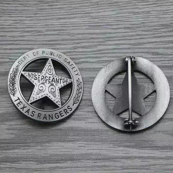 Значок Texas Rangers Company размером 4,5 см с дизайном звезды, вдохновленным мексиканским песо и символизирующим служителей закона Старого Запада