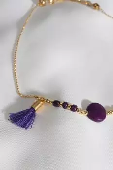 Золотой браслет с фиолетовым камнем