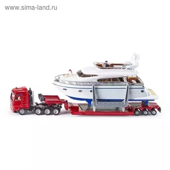 Тягач с яхтой