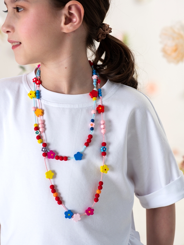 Белая детская футболка на девочку с асимметричной рюшей