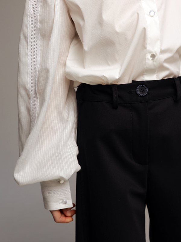 Широкие синие школьные брюки с глубокими боковыми складками на девочку