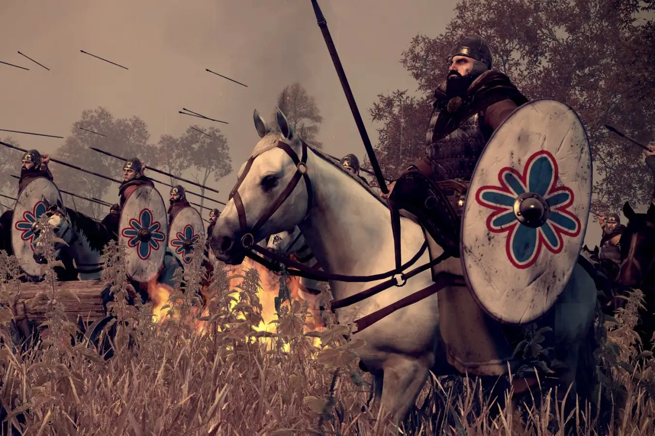 Древние готы представляли собой этнически разнообразную группу. 3 Средневековые воины на конях со щитами, стрела пролетает в воздухе, фон в огне.