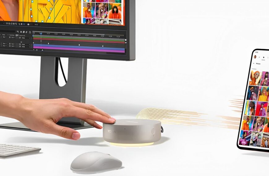 Компьютер с круглым устройством и смартфоном на белом фоне, обмен данными.