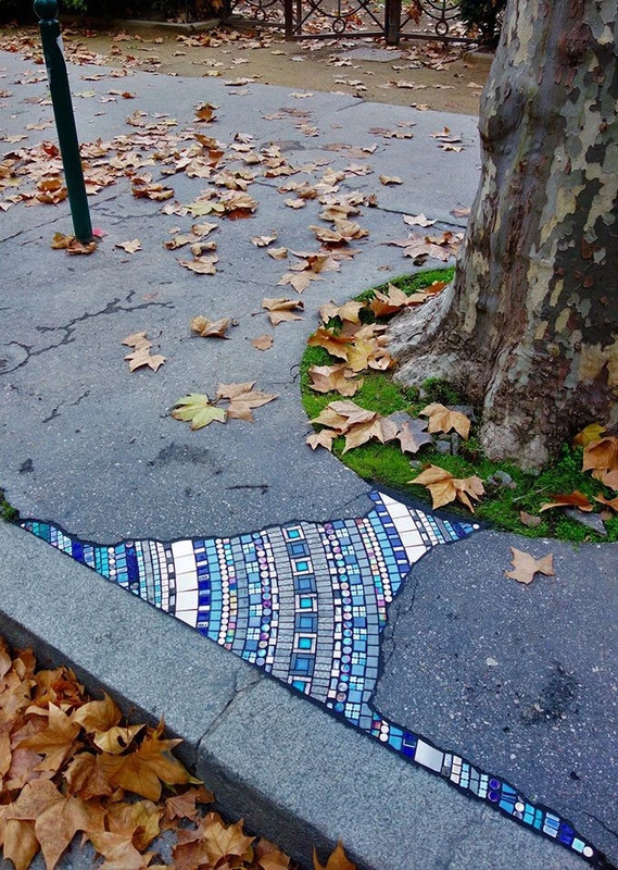 A pavement mosaic by French street artist Ememem.