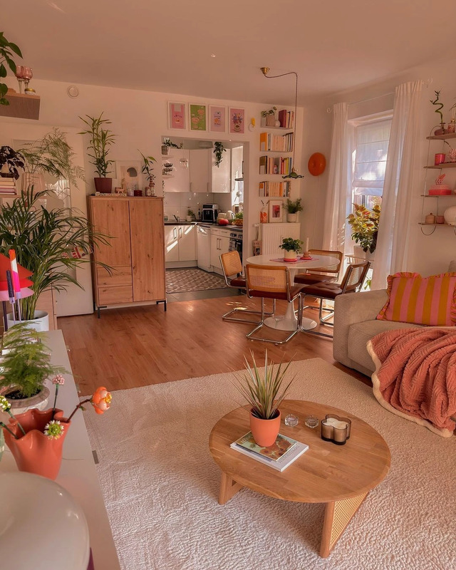 A sunny living room with a modern vintage and scandi aesthetic.